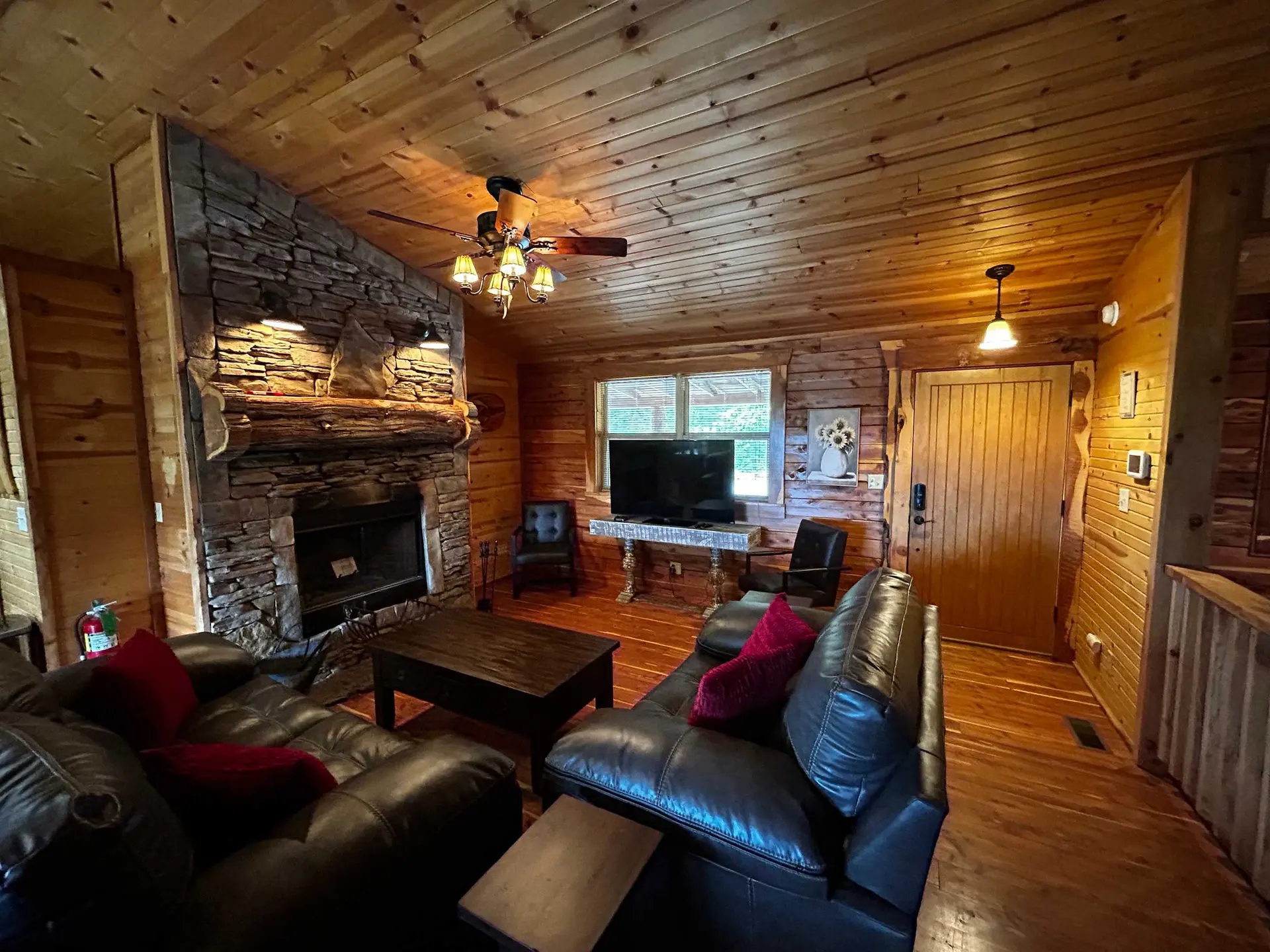 The Getaway, a Eureka Springs group cabin for six with a hot tub deck facing the ridge at sunset